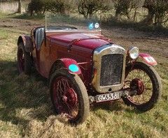 An Austin Seven. Out standing in its field.